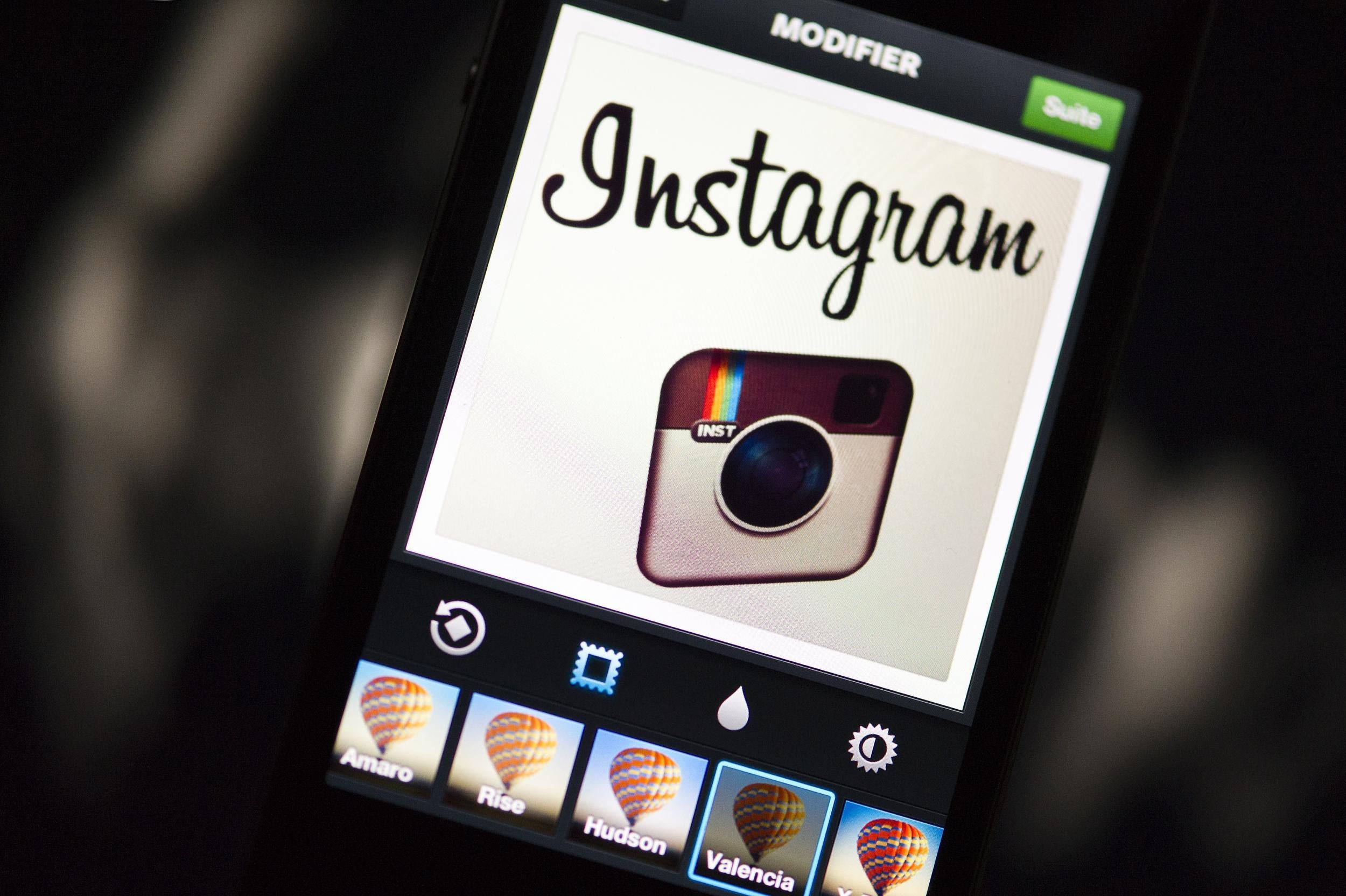Instagram's logo displayed on a smartphone