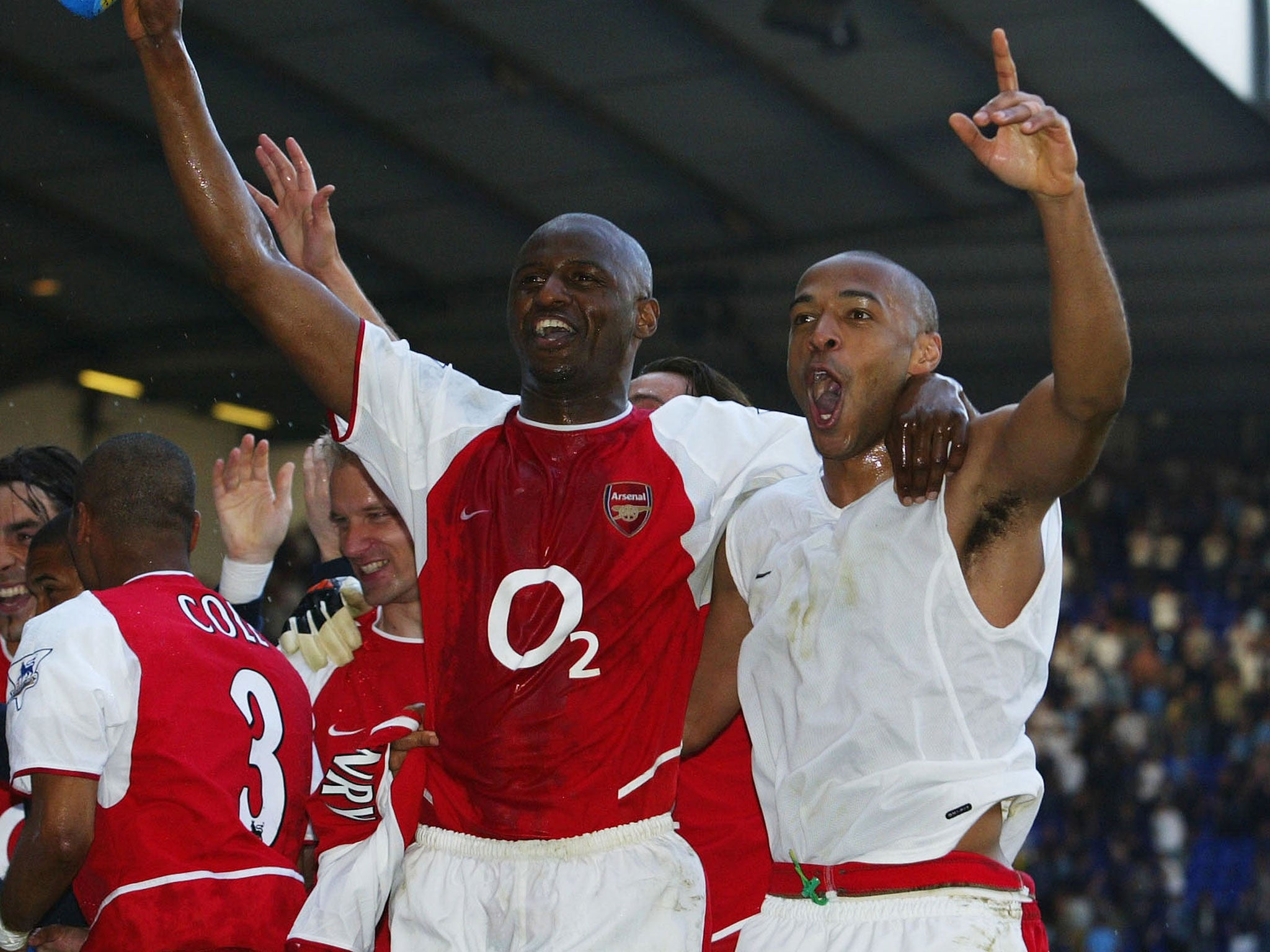 Thierry Henry and Patrick Vieira celebrate winning the title in 2004