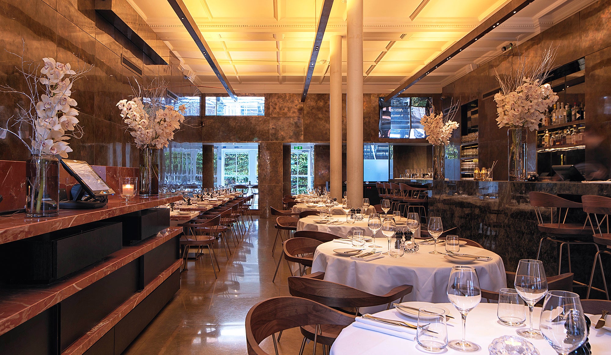 8 Mount Street is decked out with fitted warm brass panelling and a 30ft-long marble dining counter