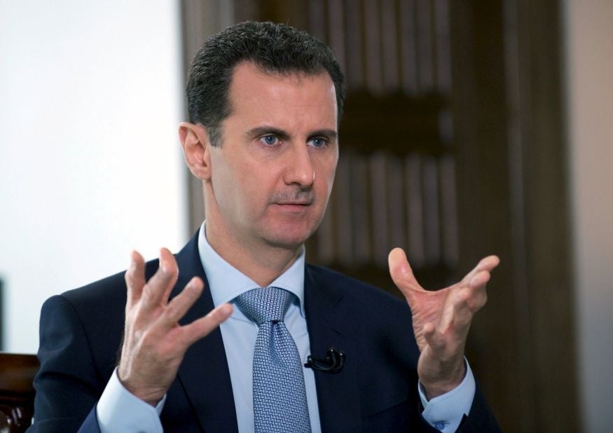 Syria's President Bashar al-Assad speaks during an interview with Russia's RIA news agency, in Damascus, Syria on March 30, 2016