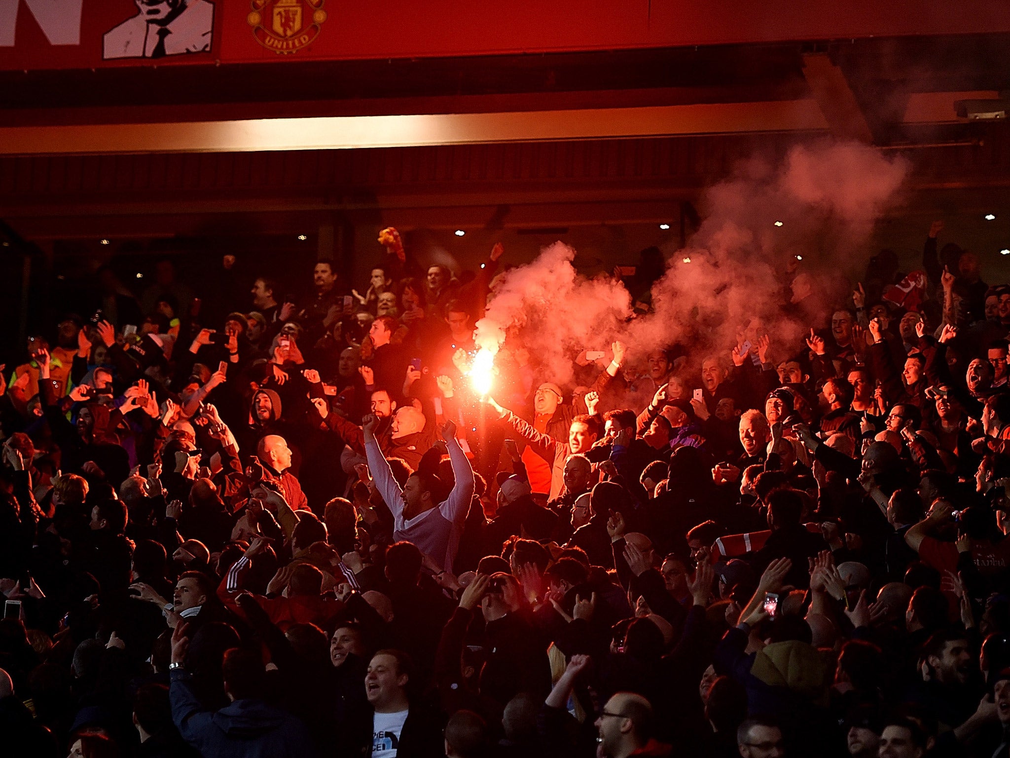 Liverpool fans were charged for lighting fireworks in the Old Trafford stands
