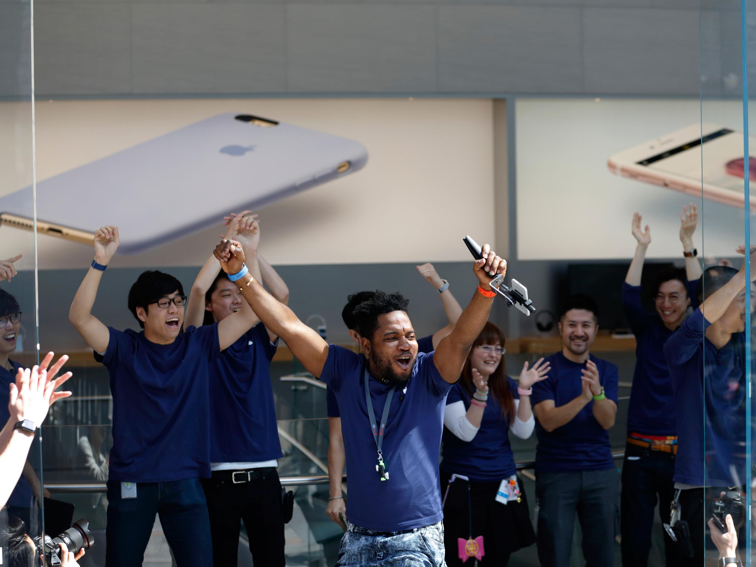 Employees cheer before the launch of Apple Inc. iPhone SE and iPad Pro 9.7 inch at the company's Omotesando store on March 31, 2016 in Tokyo, Japan