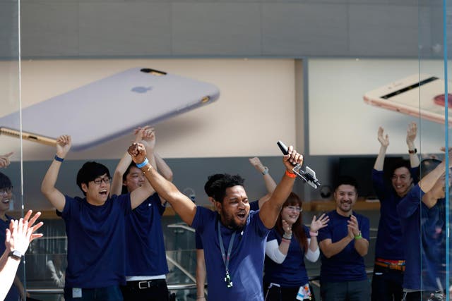Employees cheer before the launch of Apple Inc. iPhone SE and iPad Pro 9.7 inch at the company's Omotesando store on March 31, 2016 in Tokyo, Japan