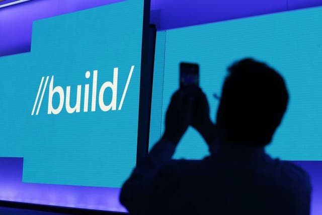 An attendee takes a picture before the start of Microsoft's Build 2016 conference