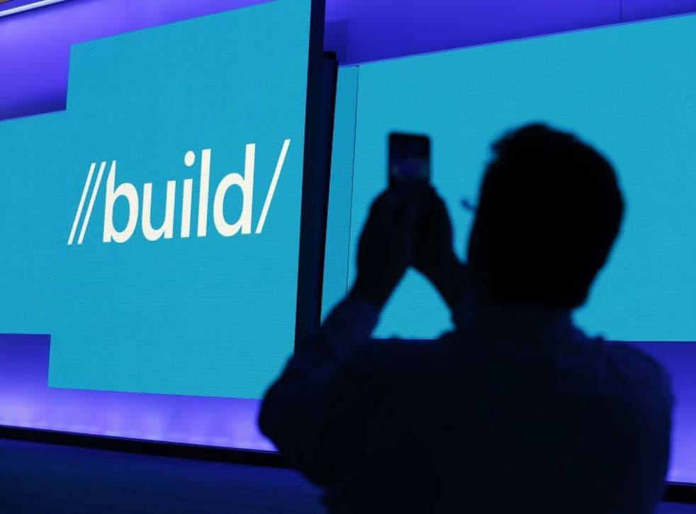 An attendee takes a picture before the start of Microsoft's Build 2016 conference