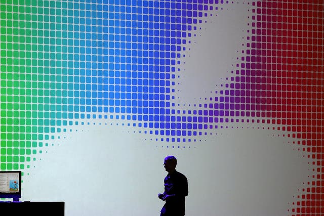 Tim Cook walks off stage after speaking during the Apple Worldwide Developers Conference at the Moscone West center on June 2, 2014 in San Francisco, California