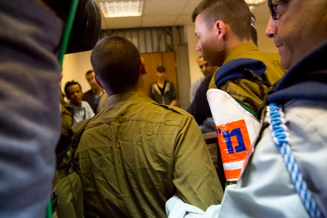The Israeli soldier is lead in to the Castina Military Court near the southern Israeli city of Ashkelon