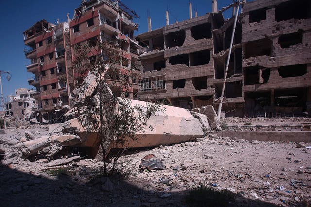 A mosque in Douma, a suburb of Damascus, hit by forces loyal to President Assad