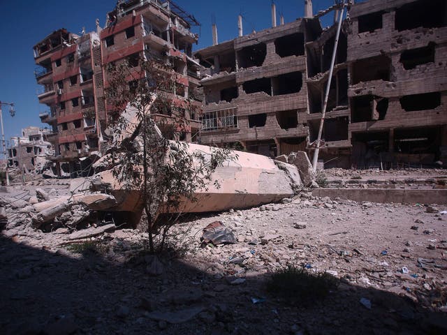 A mosque in Douma, a suburb of Damascus, hit by forces loyal to President Assad