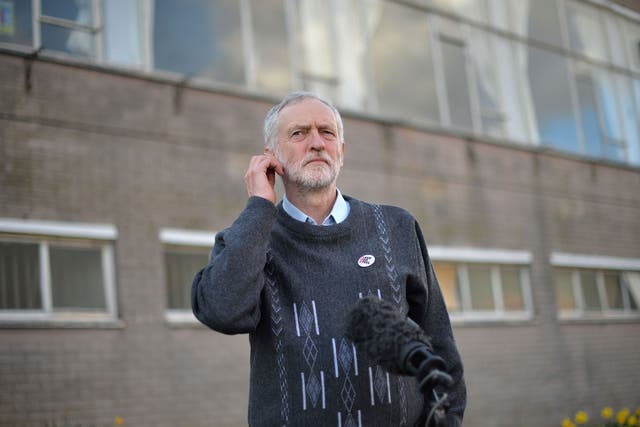 Opposition Labour Party leader Jeremy Corbyn waits to give a television interview after speaking to Tata Steel workers at the Tata sports and social club close to the company's works at Port Talbot, south Wales