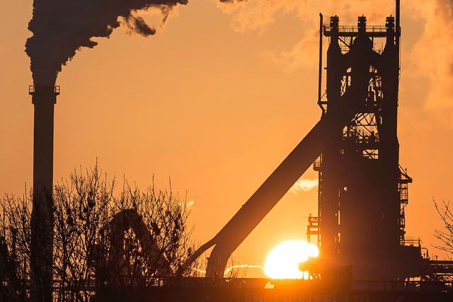 The sun rises above Tata Steel's Scunthorpe Plant in north east England