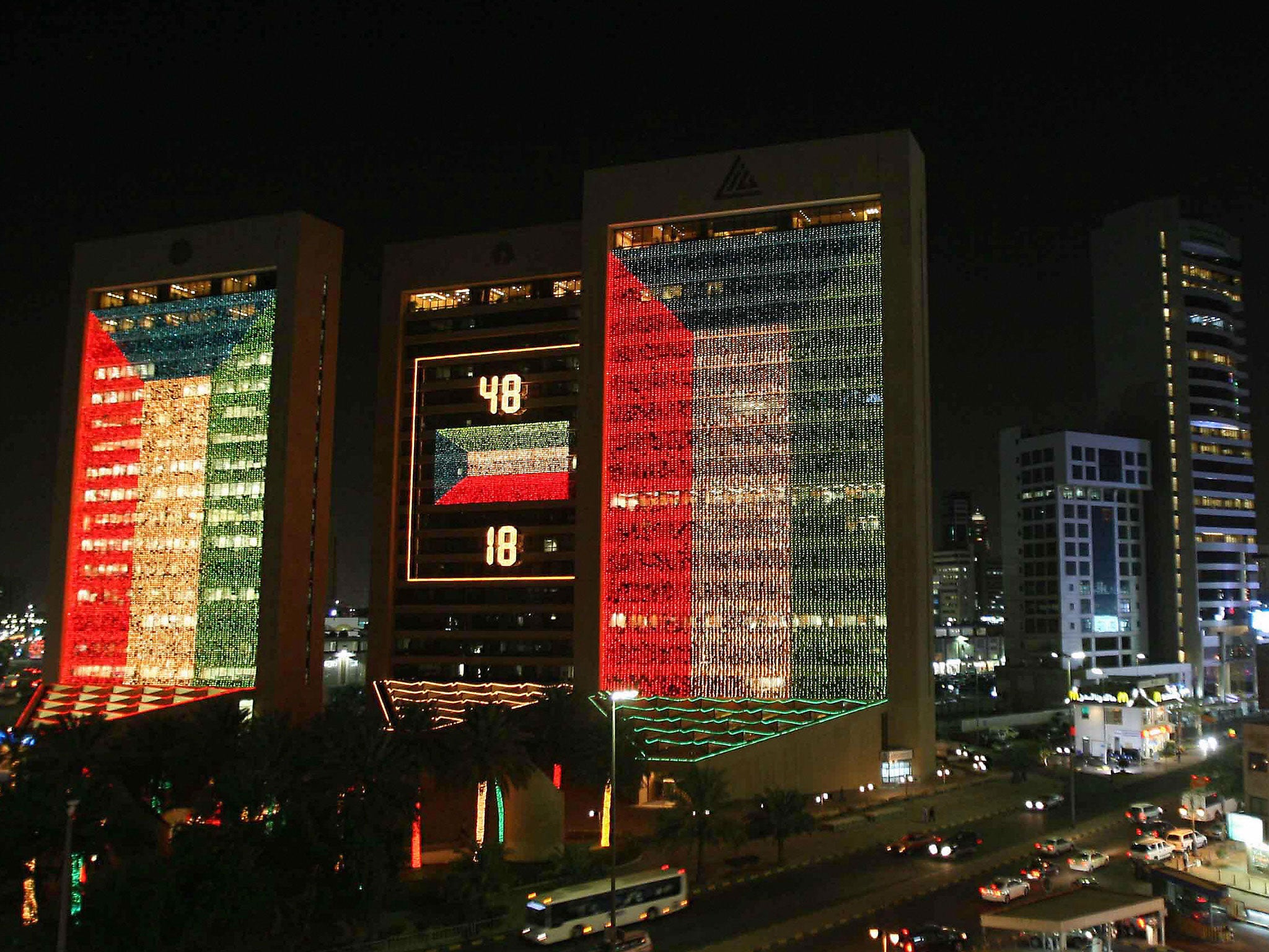 Kuwait City's banking complex is decorated with lights in the colours of the national flag on 24 February, 2009