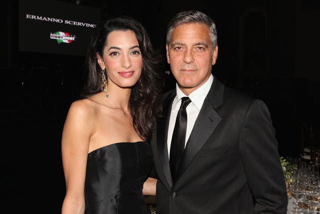 George and Amal Clooney attend the Celebrity Fight Night in Italy on September 7, 2014