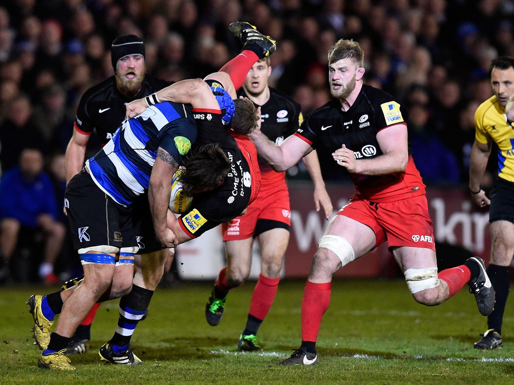 Leroy Houston of Bath upends Mike Rhgodes of Saracens resulting in a yellow card