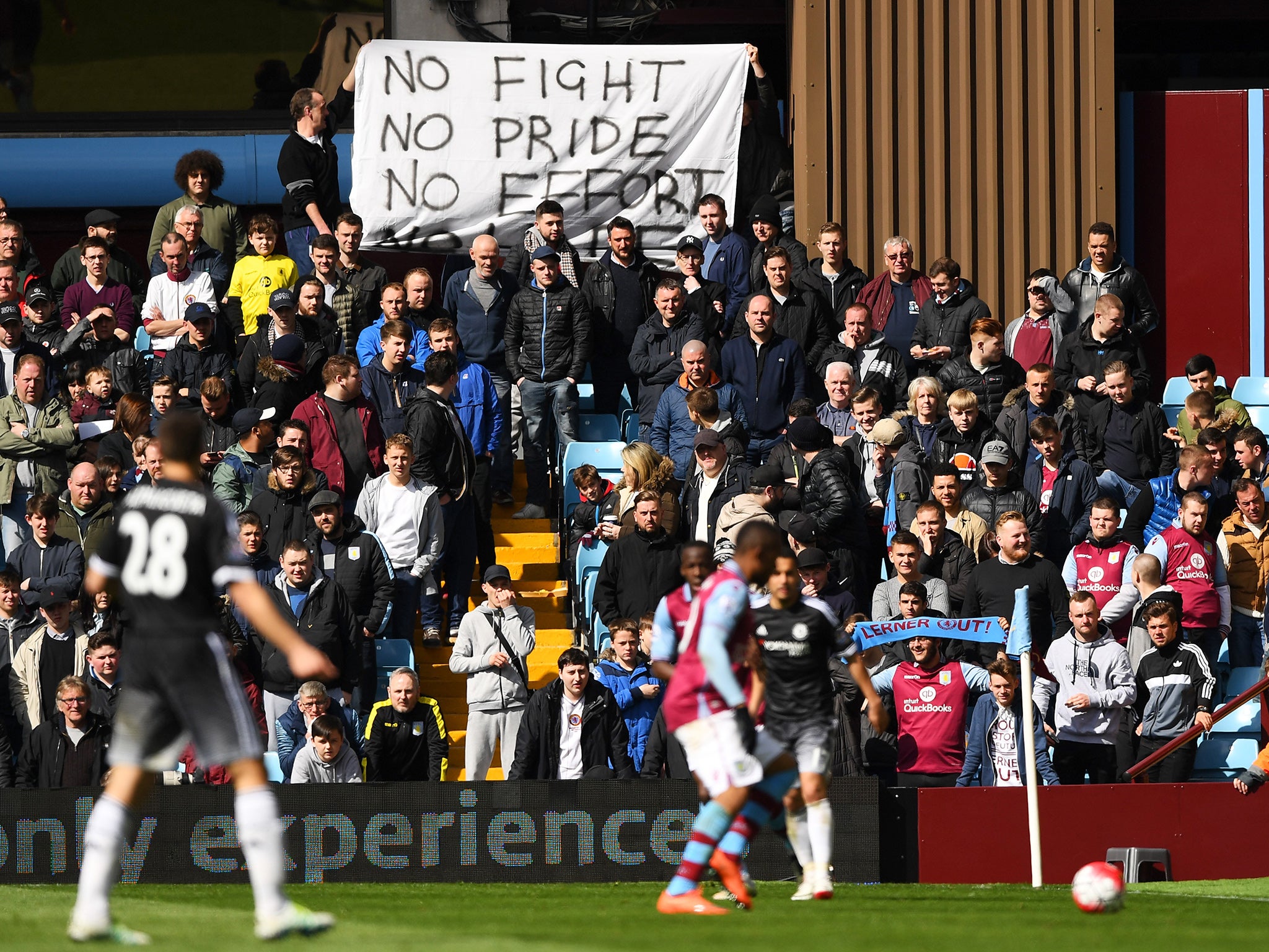 Aston Villa supporters display a protest banner during the defeat to Chelsea