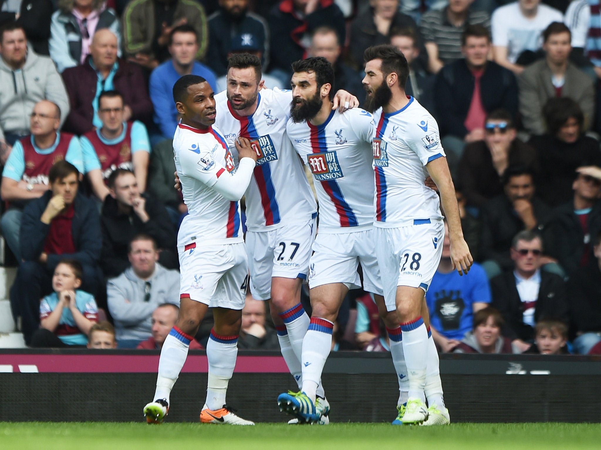 Damien Delaney celebrates with his Crystal Palace team-mates after scoring the opener