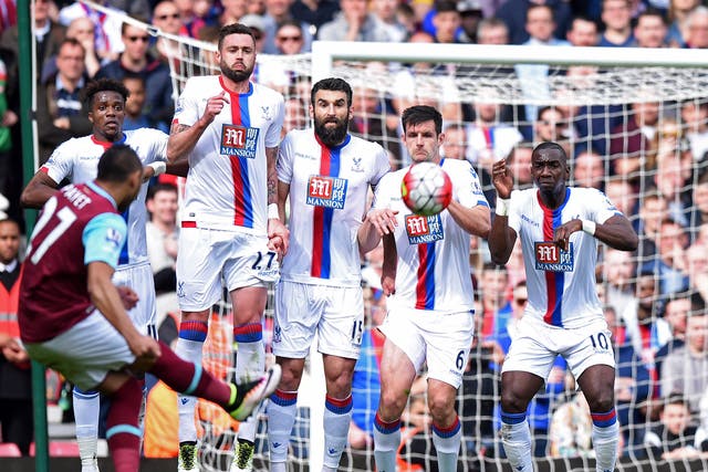 Dimitri Payet curls in a free-kick against Crystal Palace