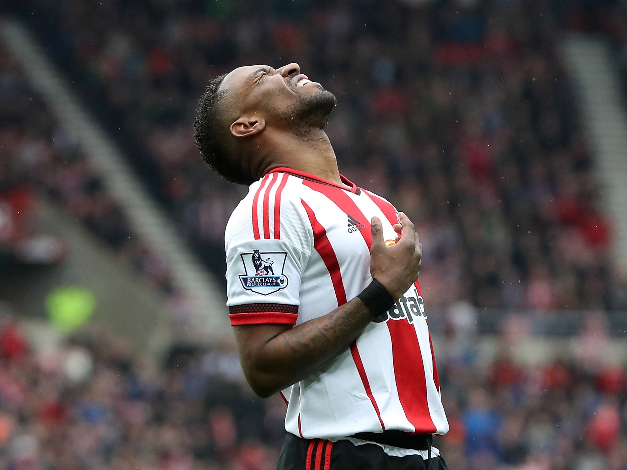 Jermain Defoe reacts after missing a chance at goal