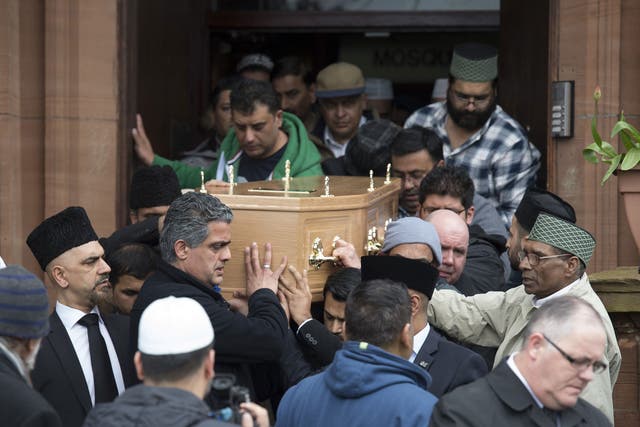 Mourners carry the coffin from Bait-Ur-Rahman Mosque