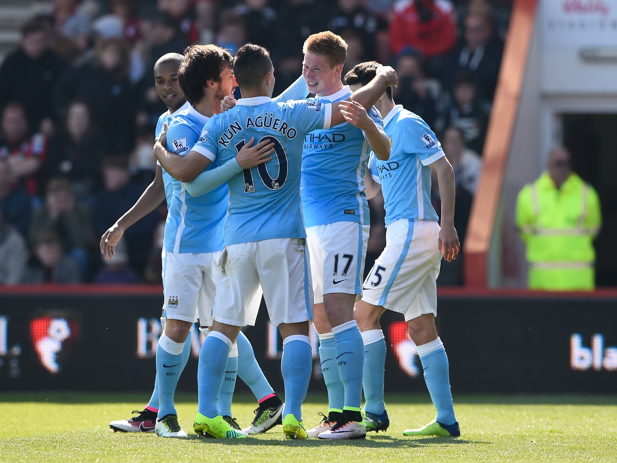 Kevin de Bruyne is congratulated by his team-mates upon scoring