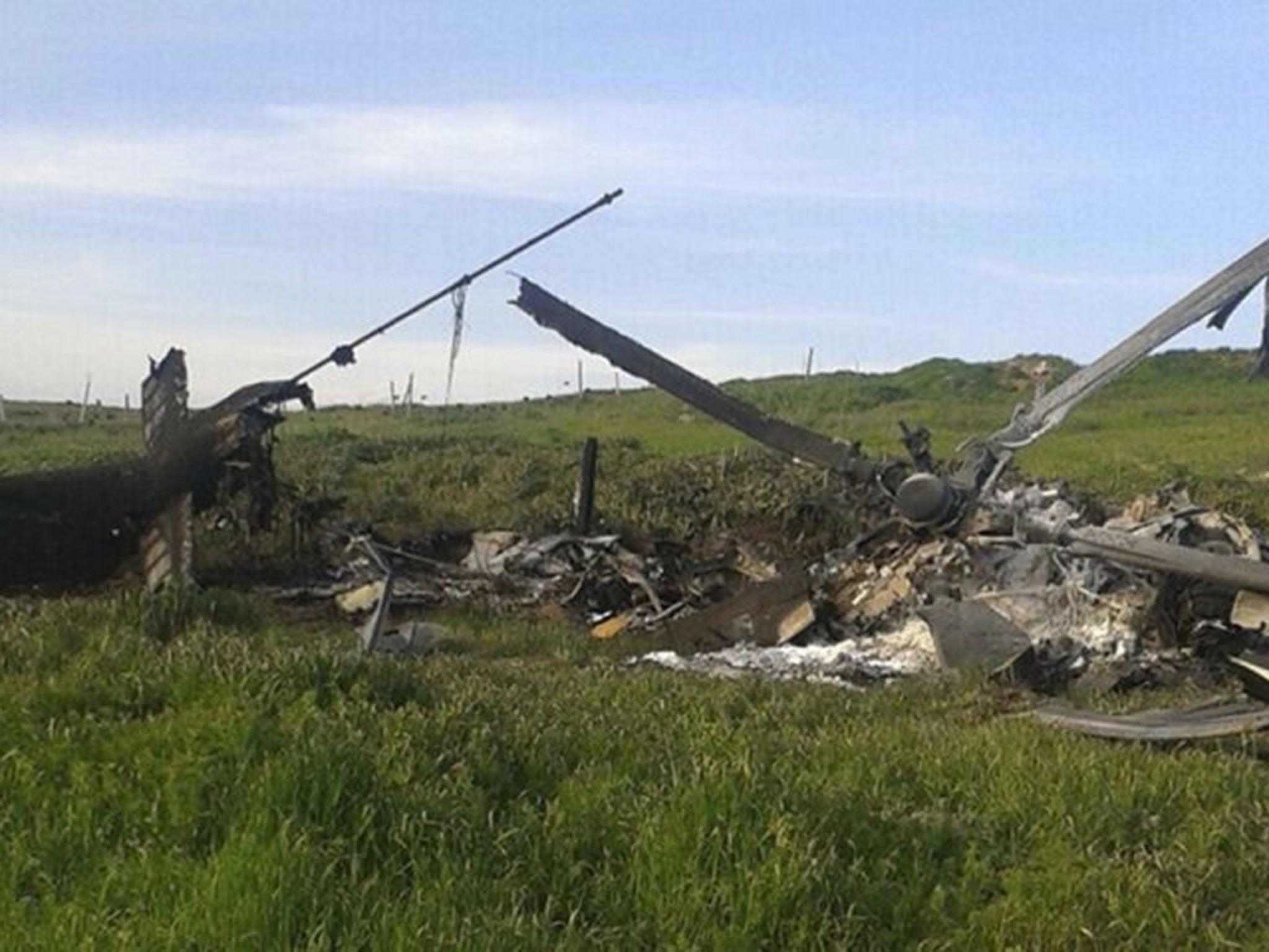 Remains of a downed Azerbaijani forces helicopter lies in a field in the separatist Nagorno-Karabakh region, on Saturday, 2 April, 2016