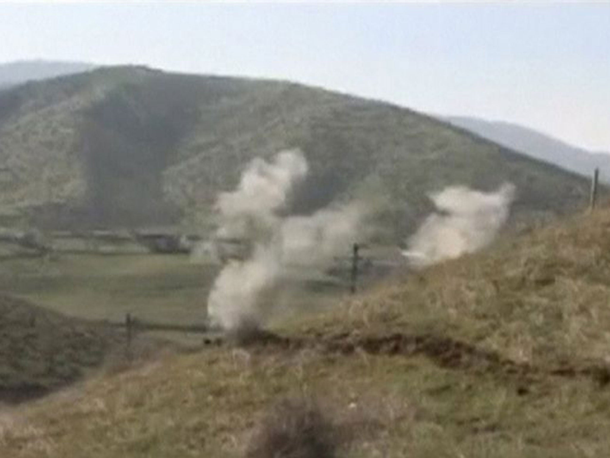Smoke rises after clashes between Armenian and Azeri forces in Nagorno-Karabakh region, which is controlled by separatist Armenians, in this still image taken from video provided by the Nagorno-Karabakh region Defence Ministry, 2 April, 2016.