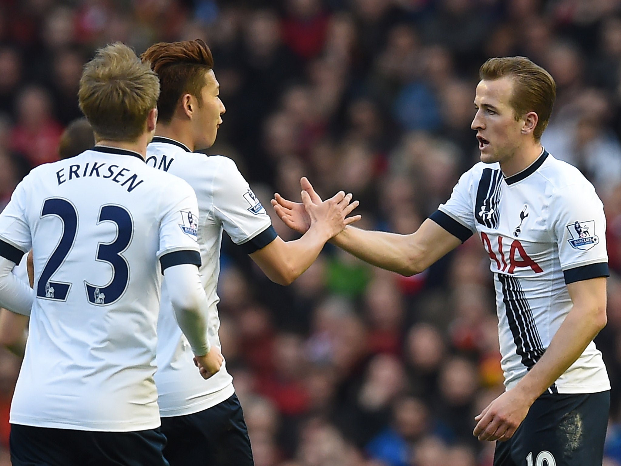 Harry Kane celebrates with Heung Min-sung and Christian Eriksen
