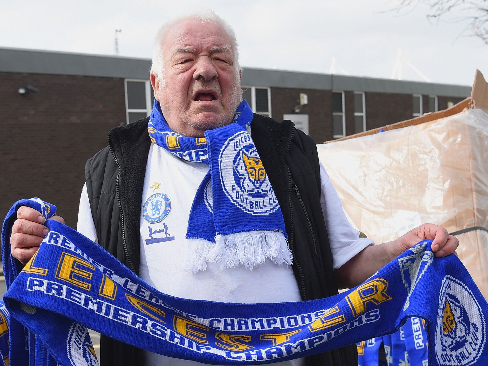 Scarves reading 'Leicester City Premiership Champions' being sold