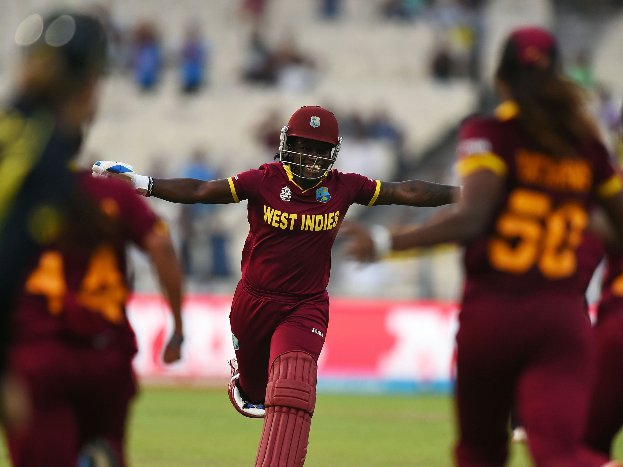 West Indies's Deandra Dottin runs towards her team-mates as she celebrates victory in the World T20 final
