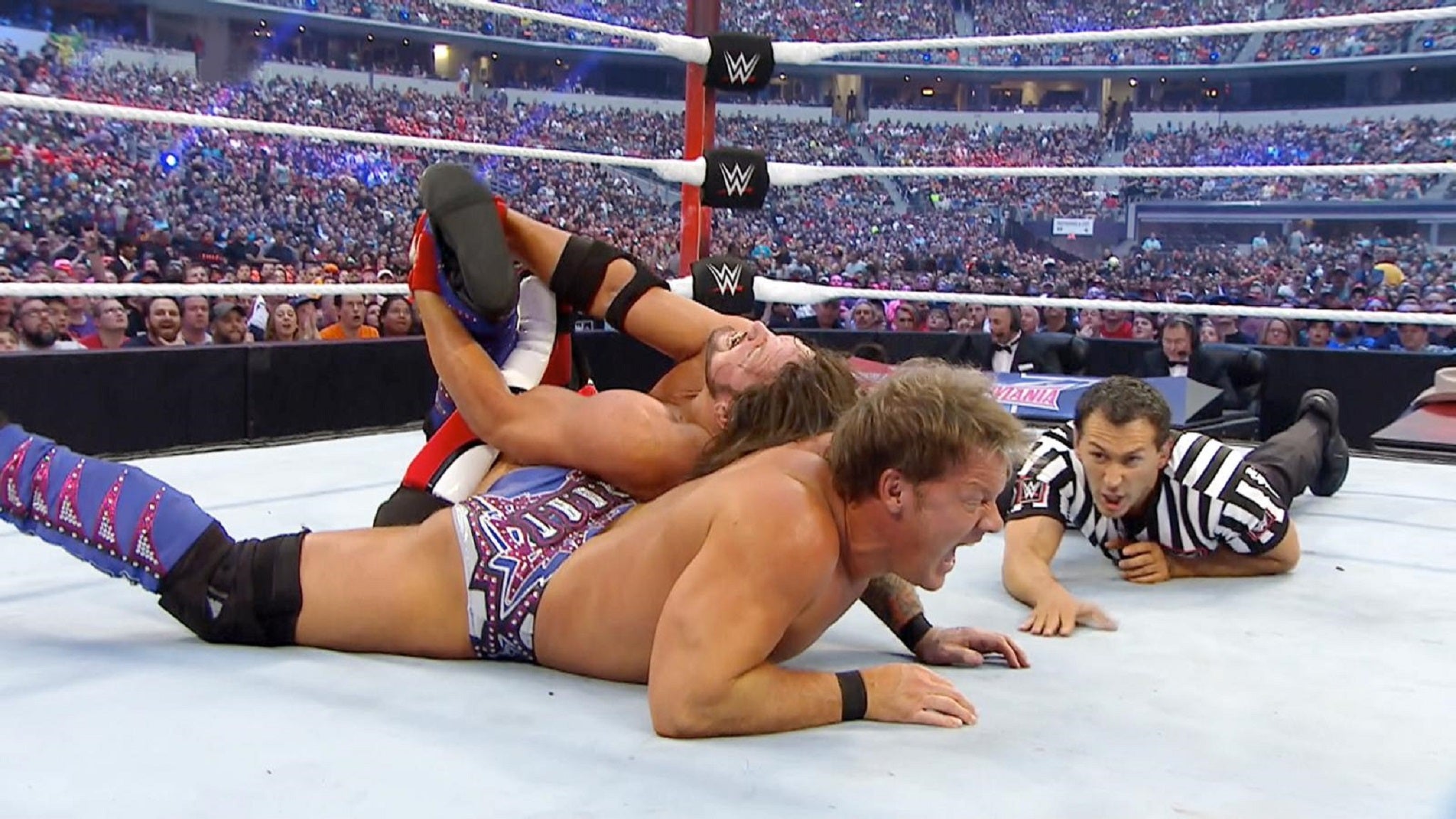 AJ Styles locks in the Calf Crusher against Chris Jericho