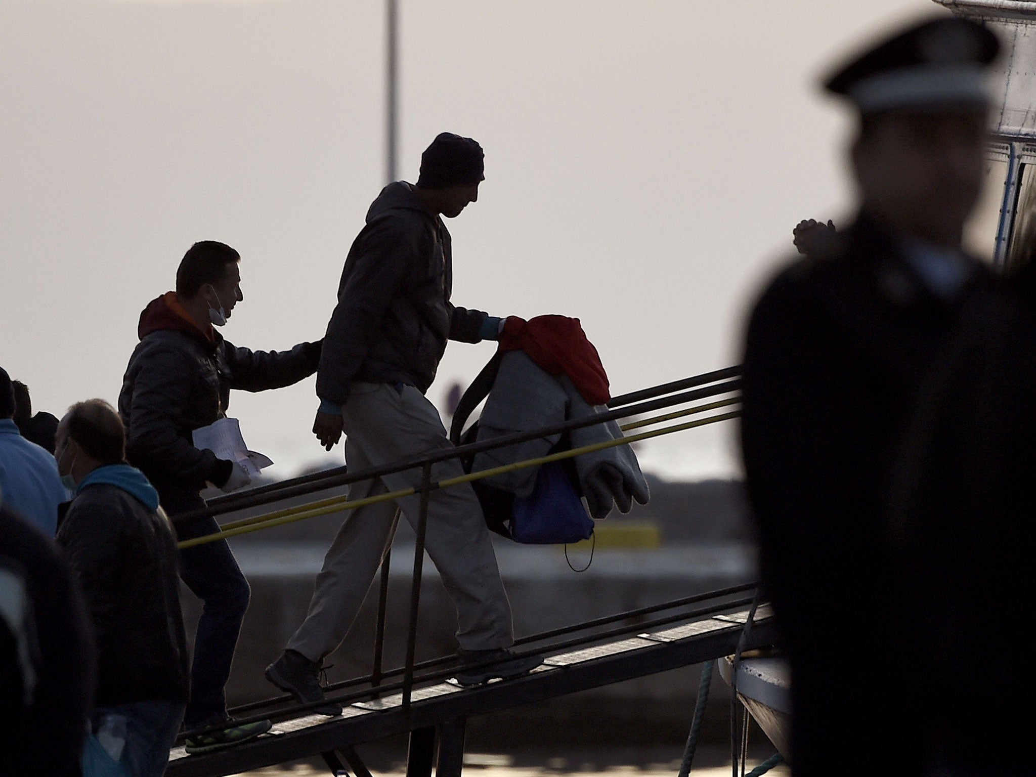 Migrants are deported to Turkey from the port of Mytilene on April 4, 201