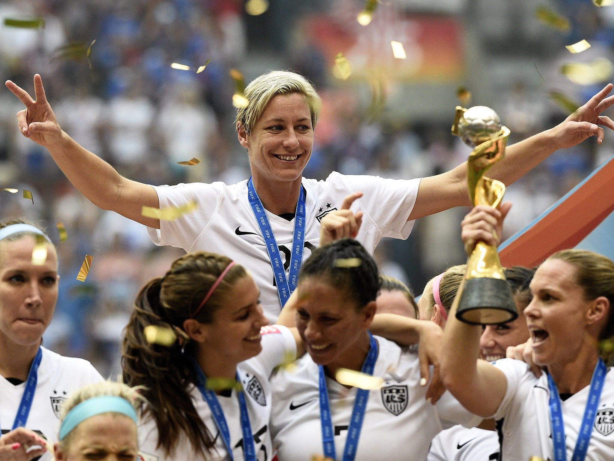 &#13;
Abby Wambach celebrates the World Cup win last summer &#13;