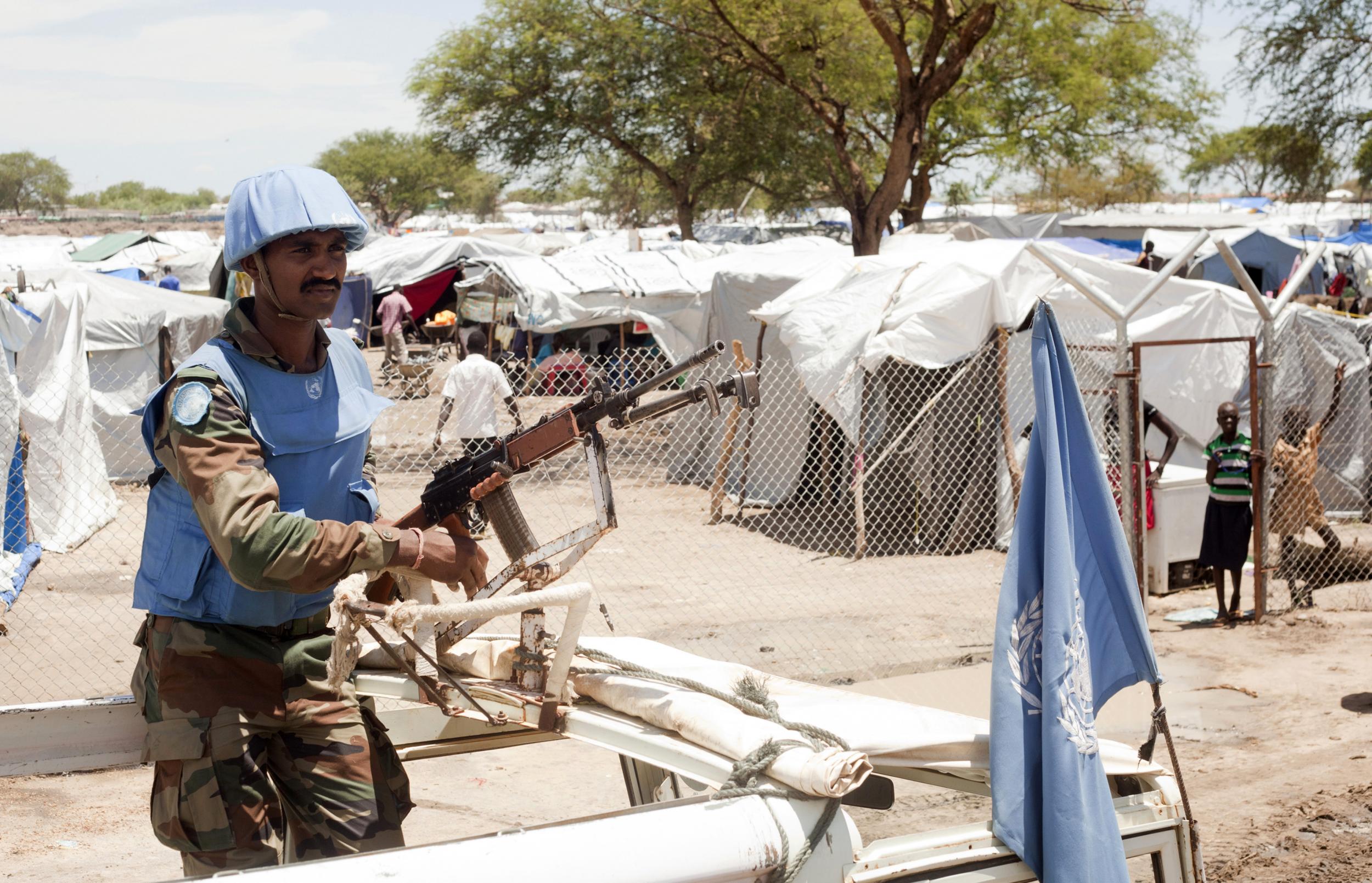 A United Nations peacekeeper keeps guard outside the Bor camp for the internally displaced in Bor town Jonglei state, South Sudan