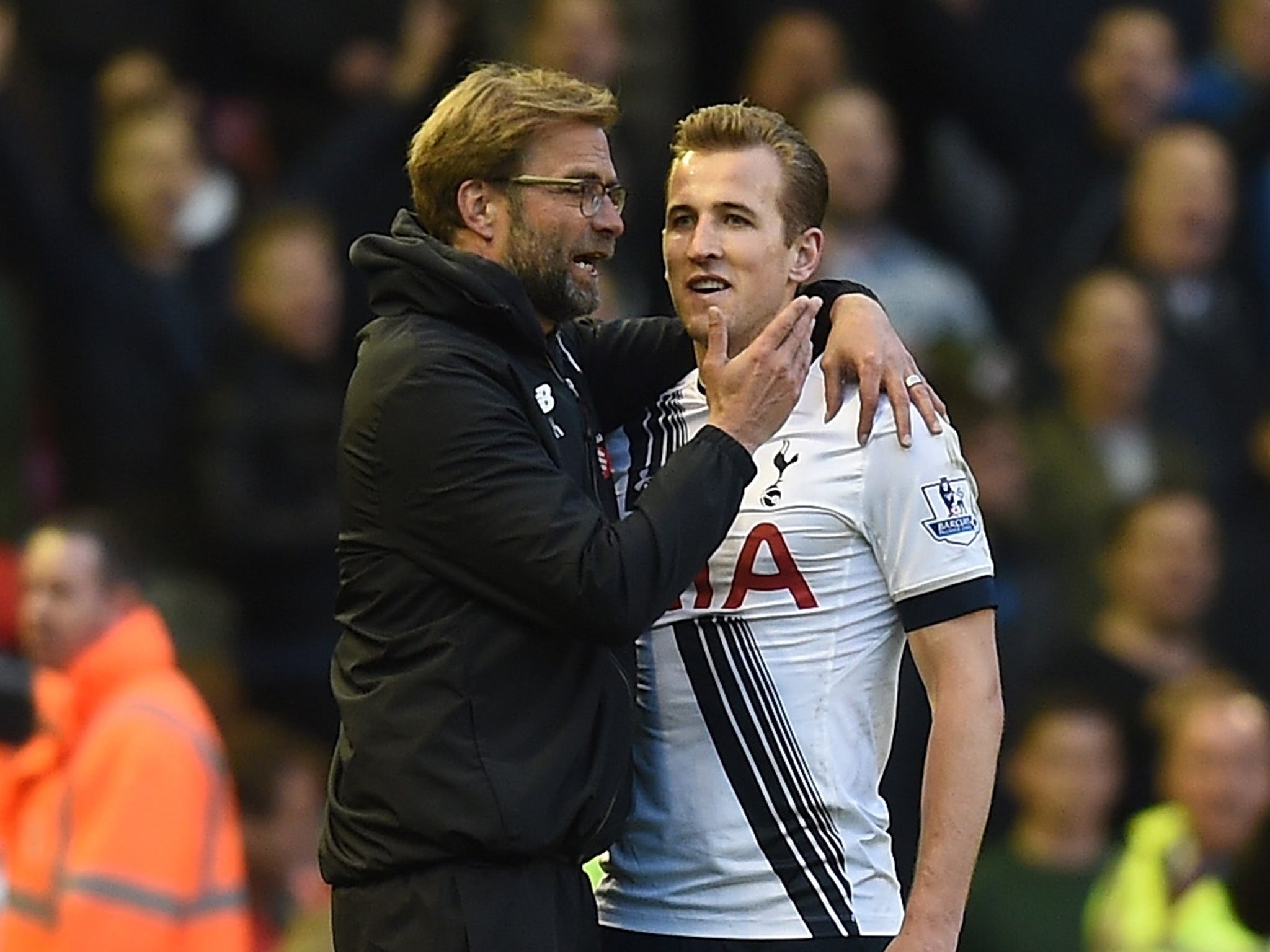 Liverpool manager Jurgen Klopp speaks with Tottenham's Harry Kane