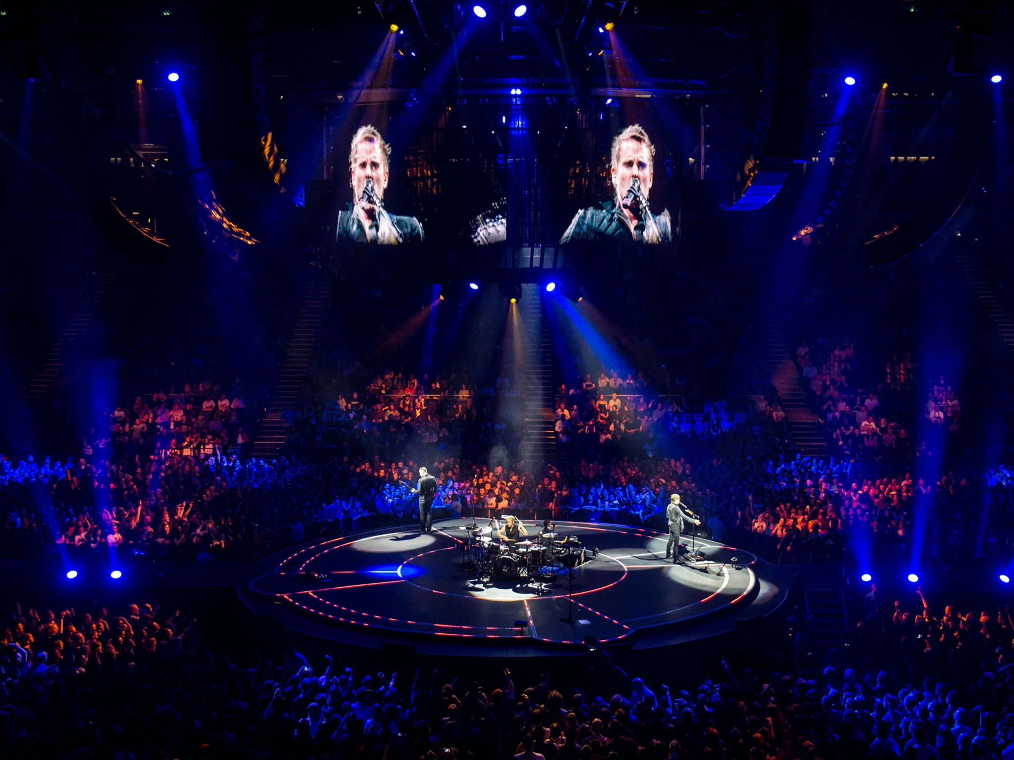 Muse perform songs from their latest album Drones at London's O2 Arena before headlining Glastonbury this summer