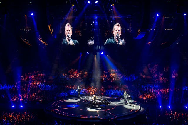 Muse perform songs from their latest album Drones at London's O2 Arena before headlining Glastonbury this summer