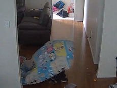 CCTV shows burglar robbing home from beneath child's duvet