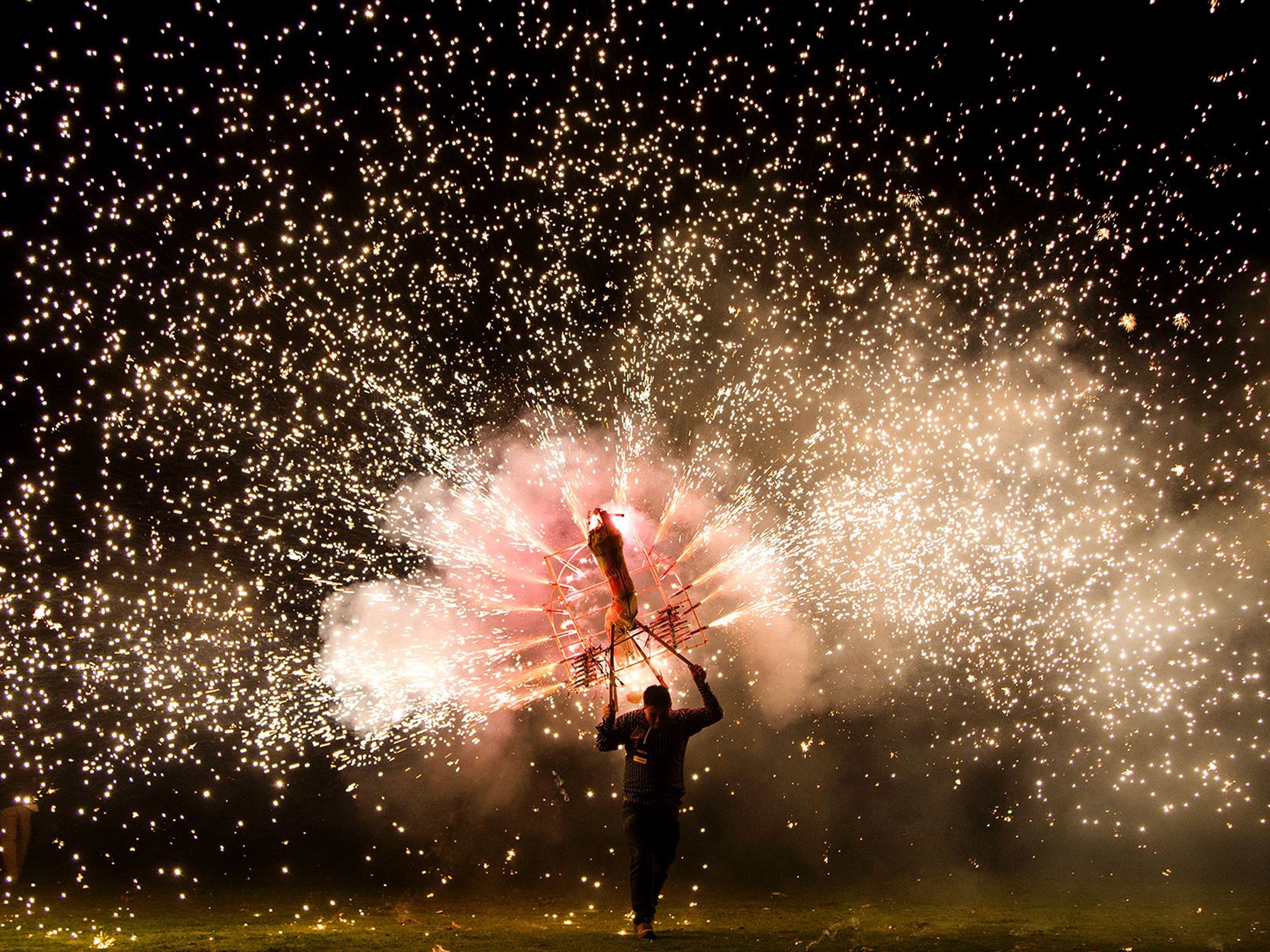 A man takes part in the International Fireworks Fair in Indaparapeo municipality, in Michoacan State, Mexico