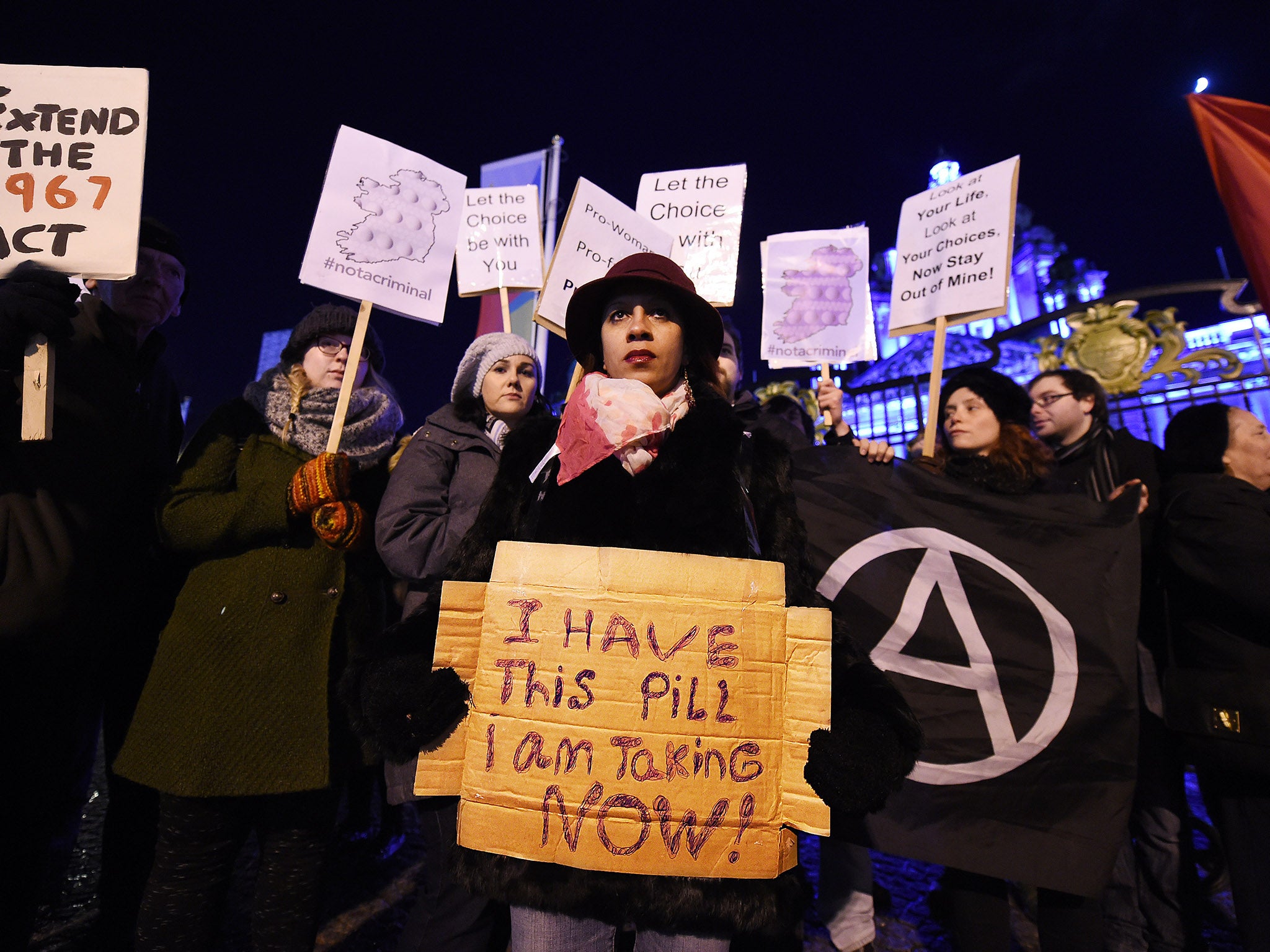 Campaigners protest the prosecution of the 21-year-old outside City Hall in Belfast in January