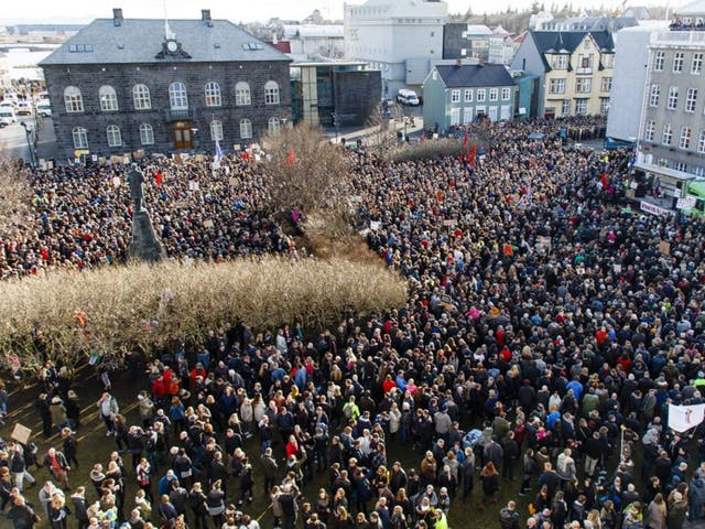 People gather during a protest on Austurvollur Square in front of the Icelandic Parliament in Reykjavic, Iceland, calling for the resignation of prime minister Sigmundur Davíð Gunnlaugsson on 04 April, 2016,