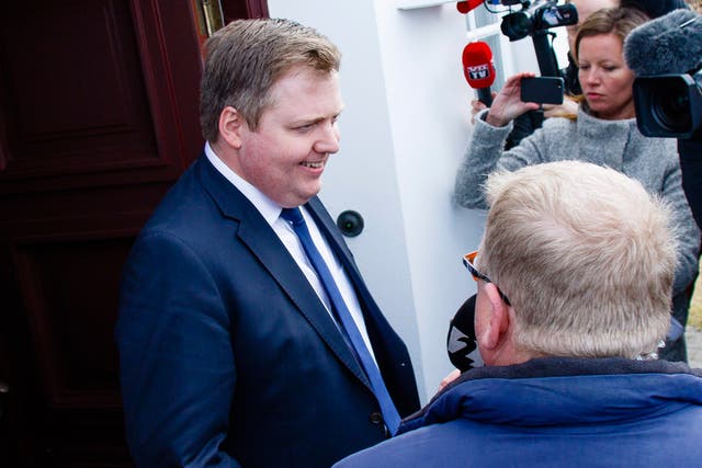 Iceland's Prime Minister Sigmundur David Gunnlaugsson talks to media outside the residence of Iceland's President President Olafur Ragnar Grimsson after a meeting of the two in Reykjavik