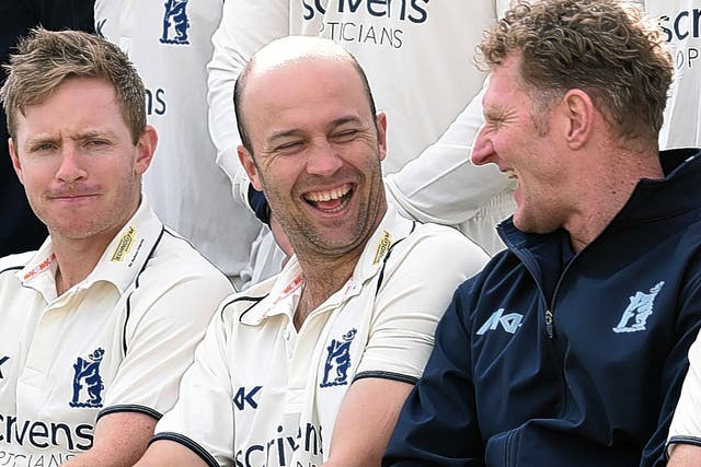 Jonathan Trott (centre) enjoys a laugh during the Warwickshire team photo