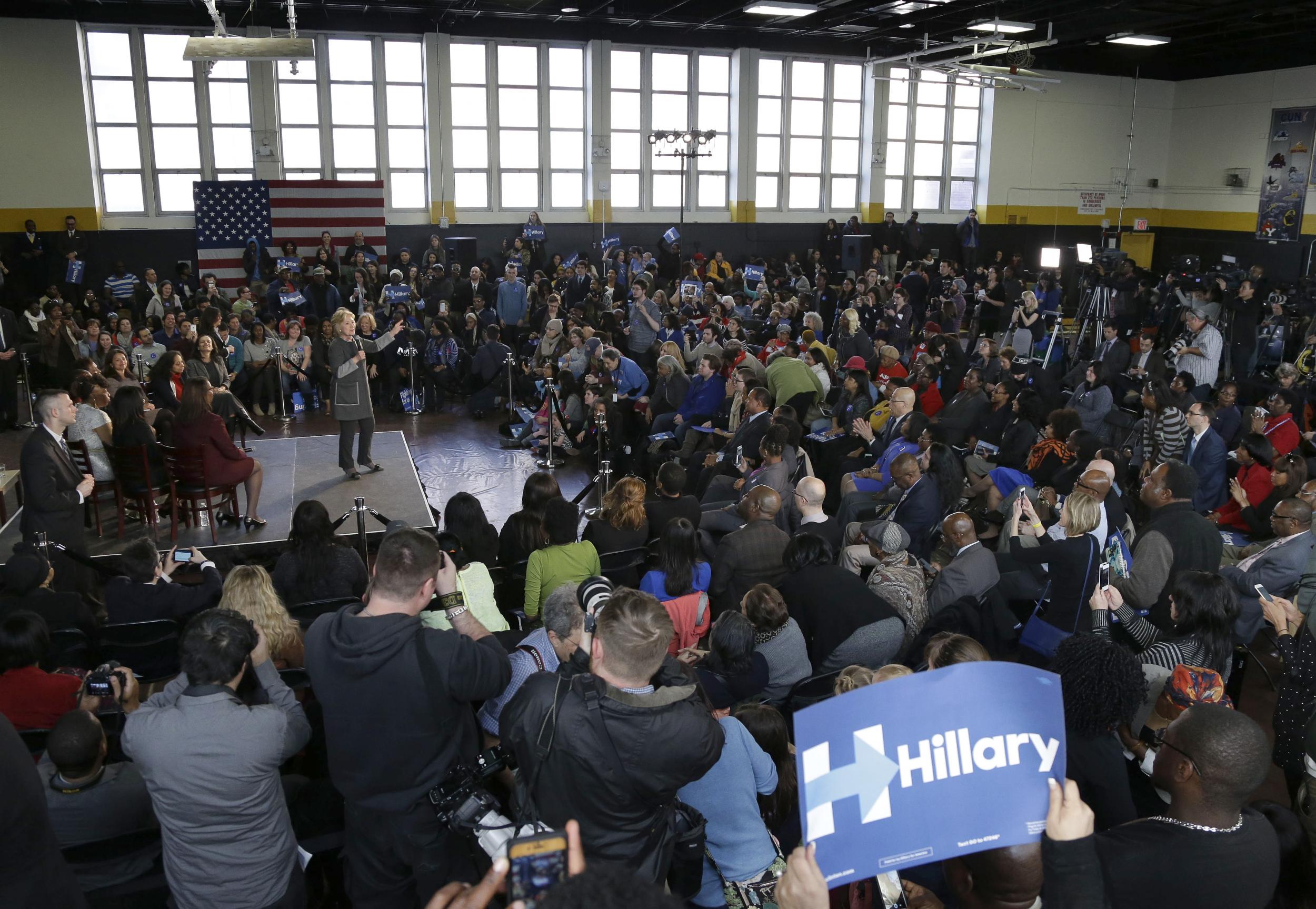 Hillary Clinton speaks to a full house in the Medgar Evers College gymnasium AP