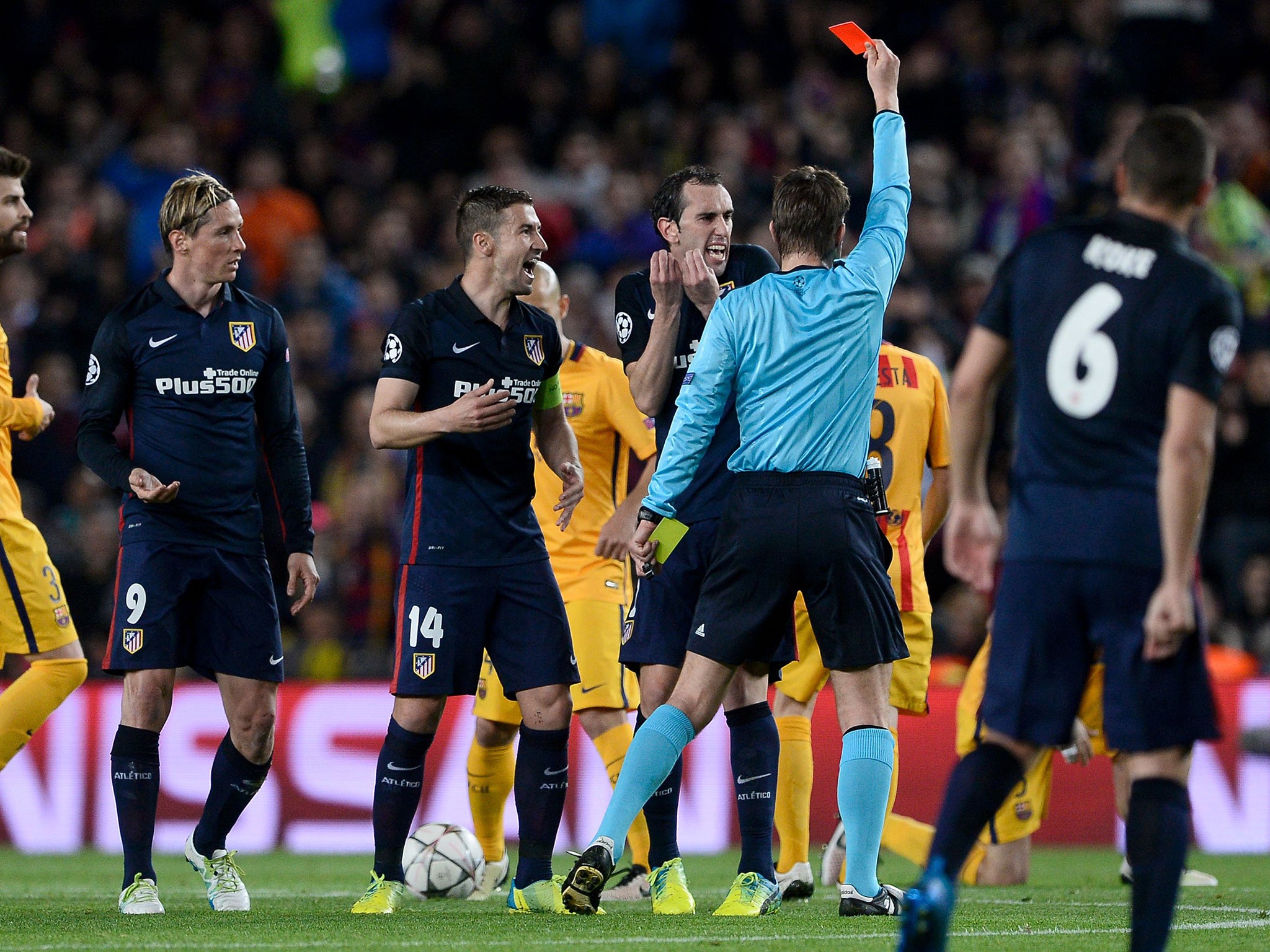 Fernando Torres (left) receives his second yellow card and is sent off