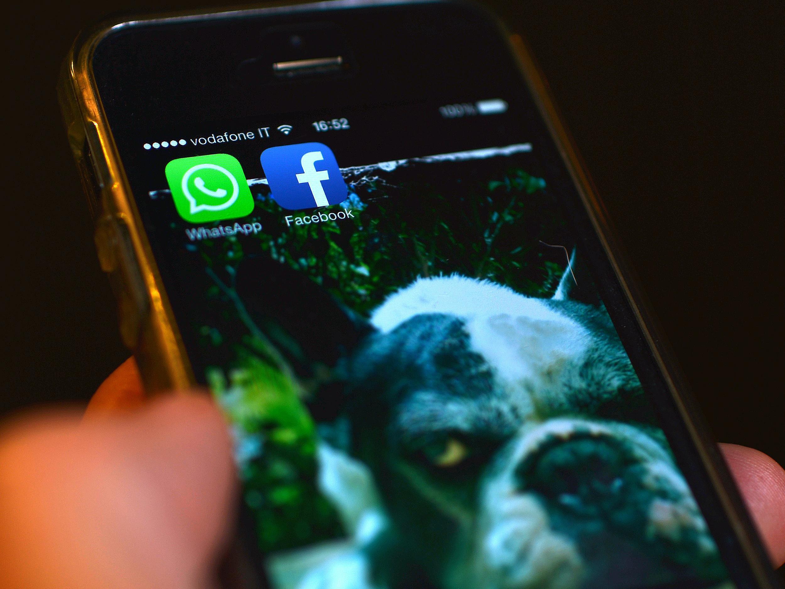 The Facebook and WhatsApp applications' icons are displayed on a smartphone on February 20, 2014 in Rome