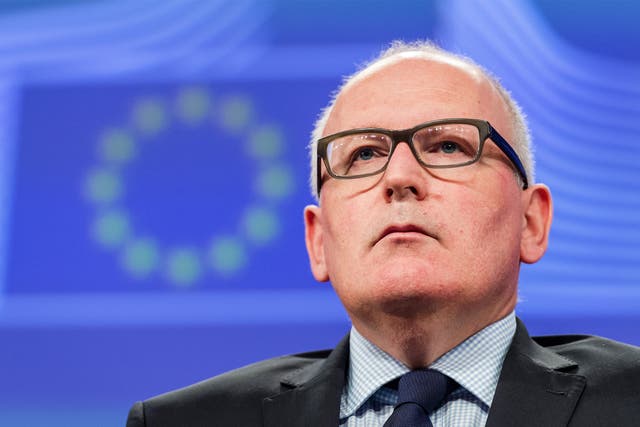 EU Commission Vice President Frans Timmermans addresses the media in Brussels