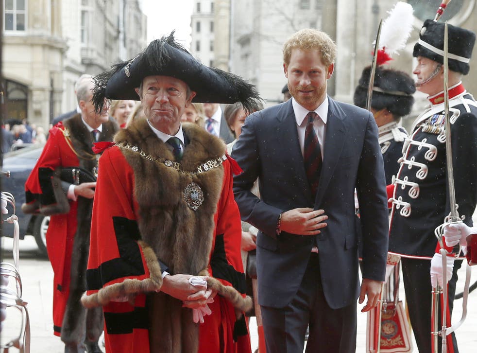 Prince Harry is greeted by the Lord Mayor of the City of London Lord Mountevans as he arrives at The Lord Mayor's Big Curry Lunch at The Guildhall in London