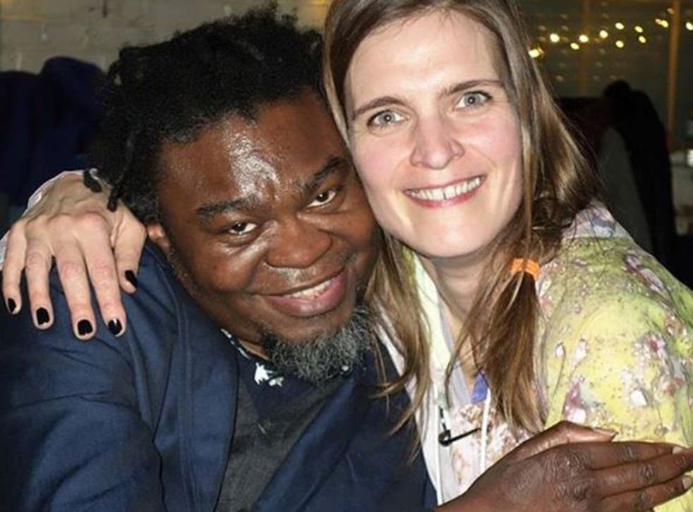 German born Katrin Lock hugs British-Nigerian Yinka Shonibare