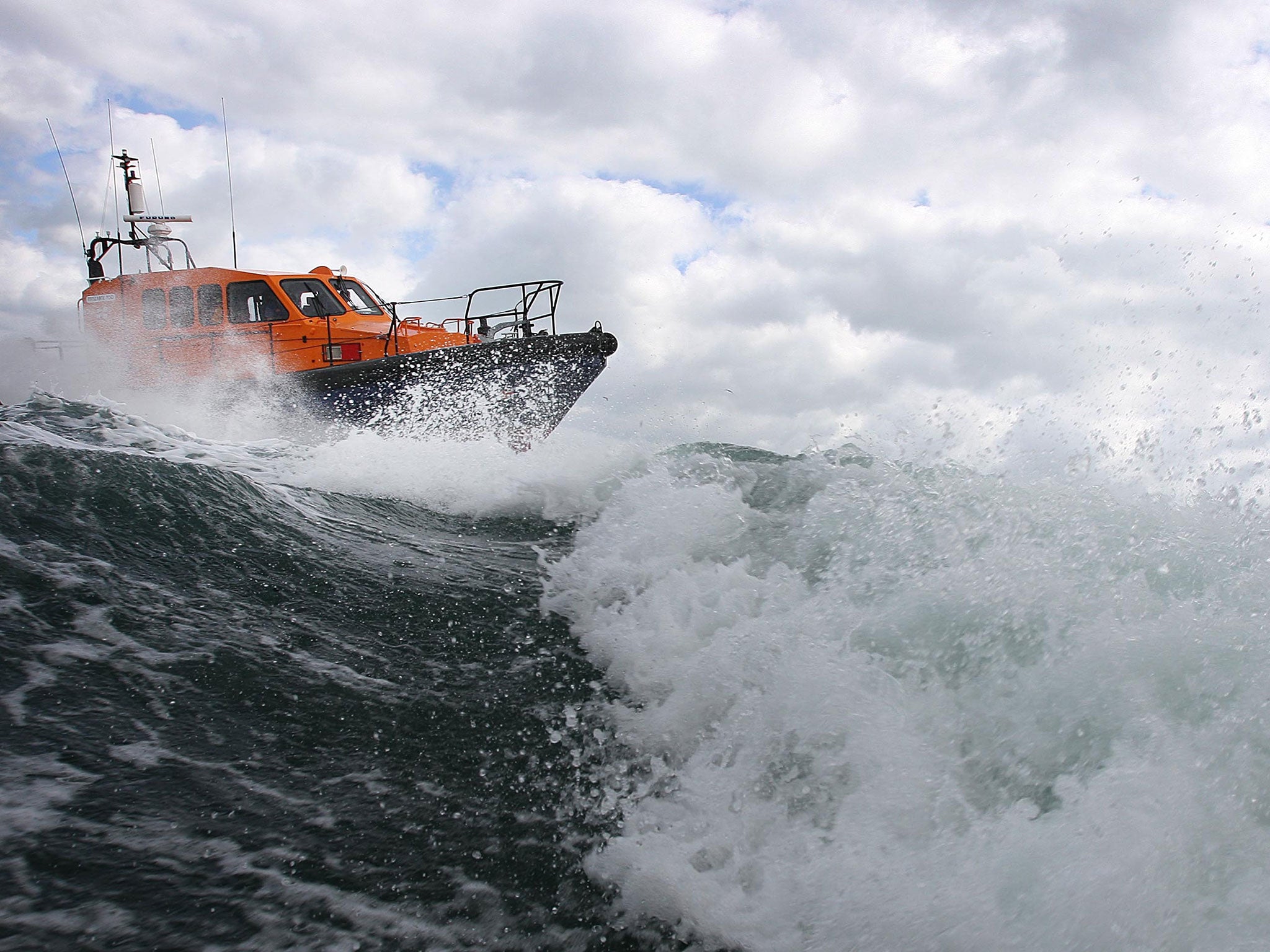 Three RNLI lifeboats and helicopter are searching the area