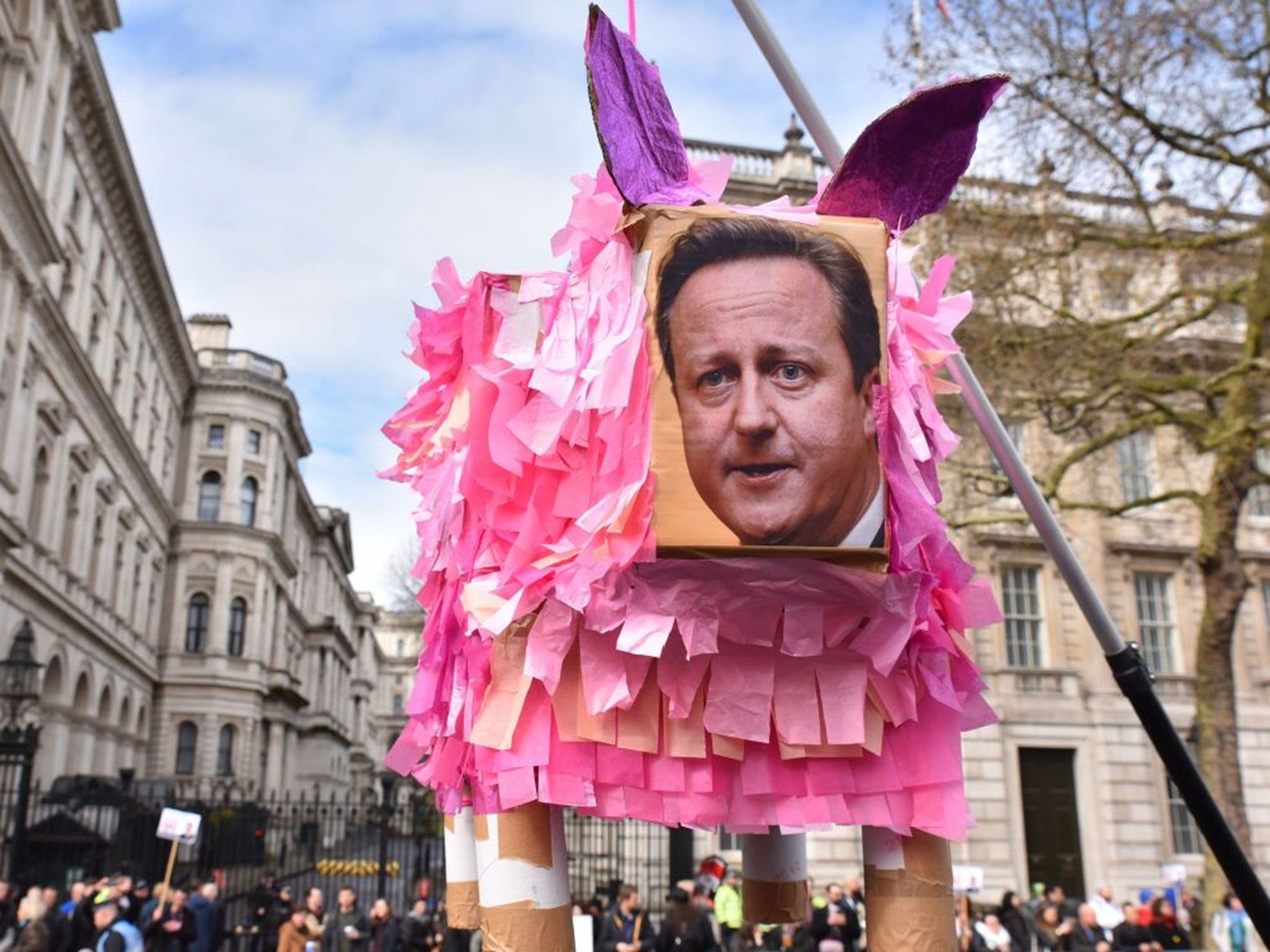 David Cameron pig sculpture besides Downing Street